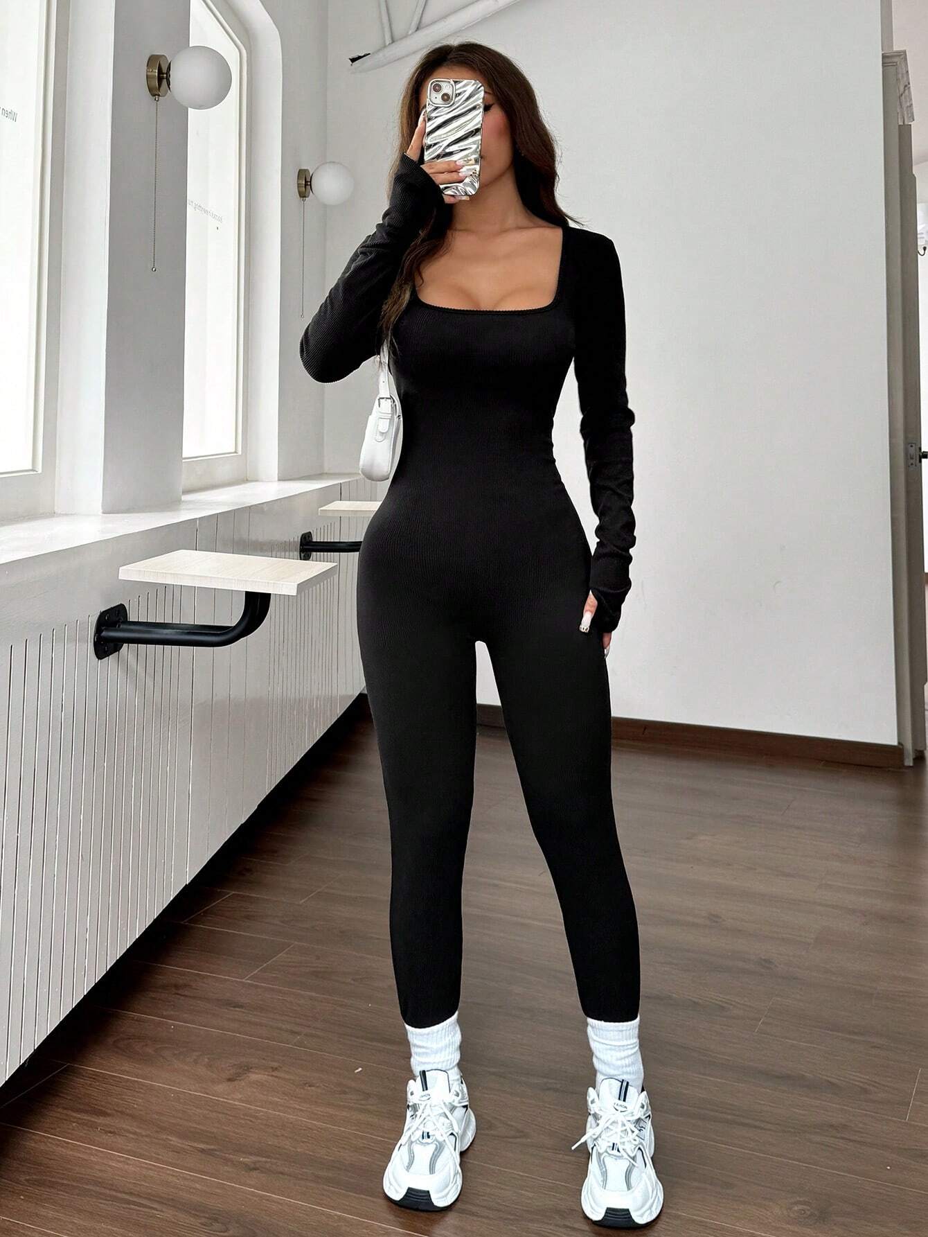 "ThermaFlex™ Sculpting Jumpsuit – Warmth Meets Curves"